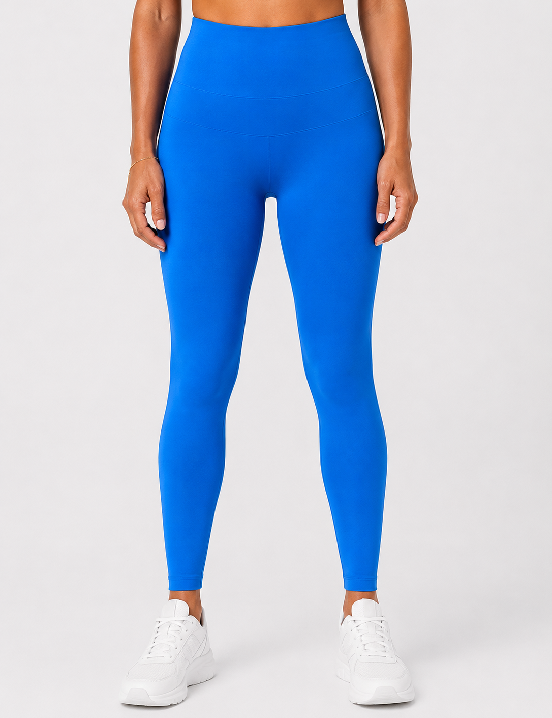 Front view of style luxe electricave high-waist blue leggings on model