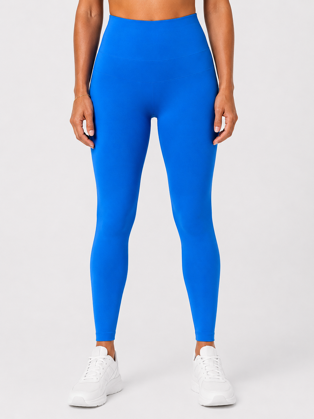 Front view of style luxe electricave high-waist blue leggings on model