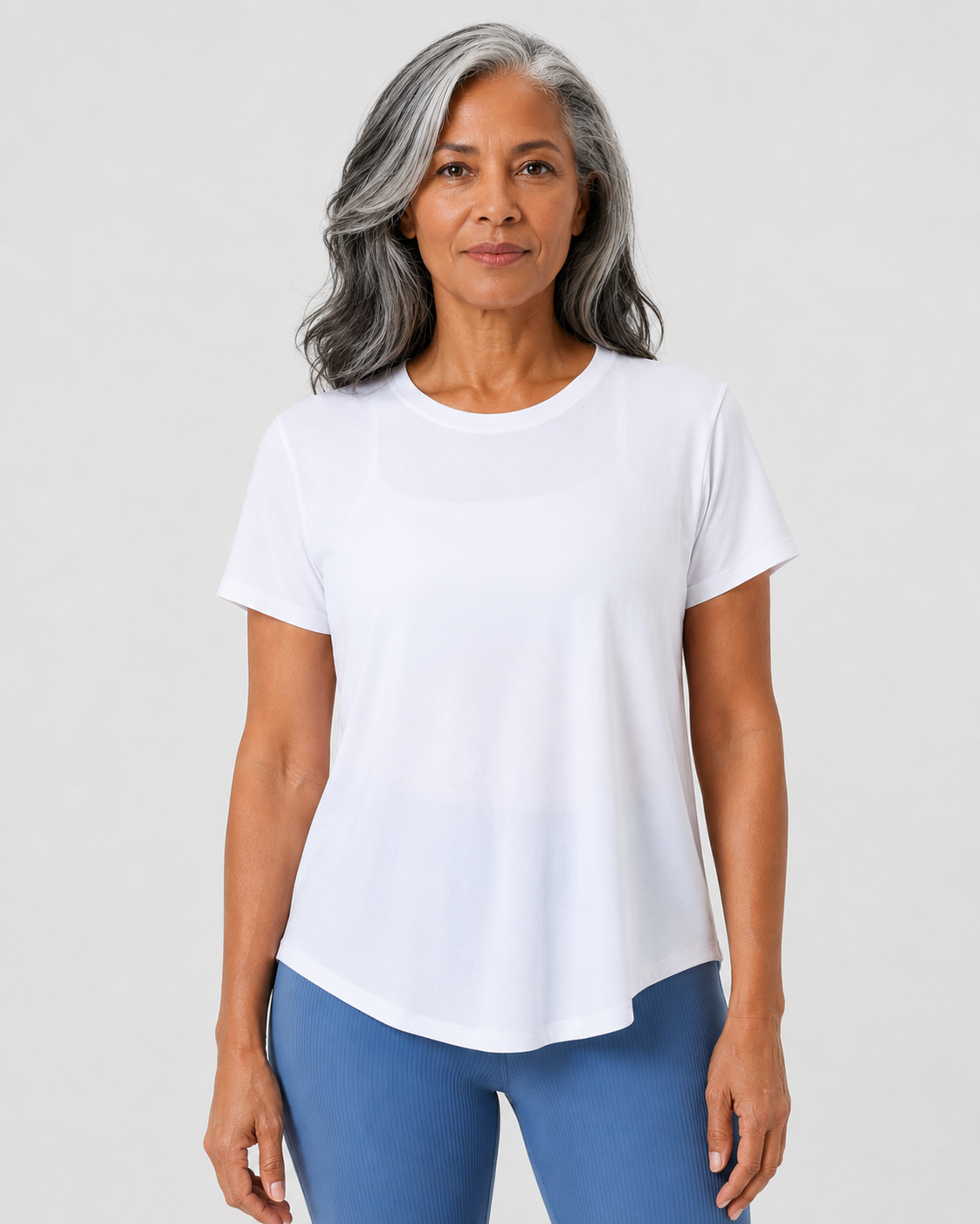 mid age lady wearing white flow tie top from style luxe activewear