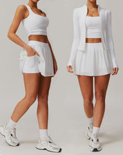 Two people wearing white athletic outfits on a plain background