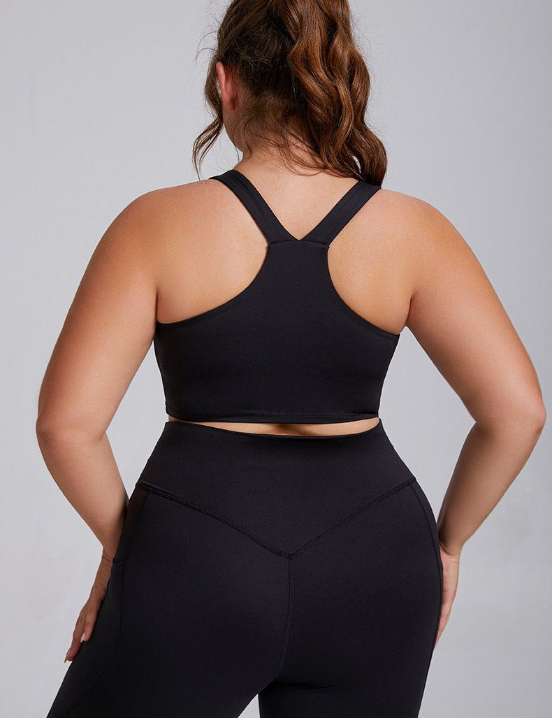 medium to high support sports bra in black, back view.